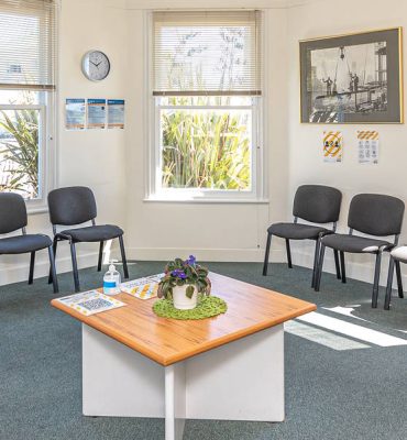 Waiting room with chairs and tabled